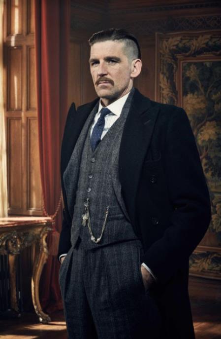 Arthur Shelby in a Gray Plaid Peaky Blinders 3-piece vested suit with dark overcoat